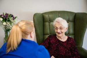 Carer Smiling with Resident