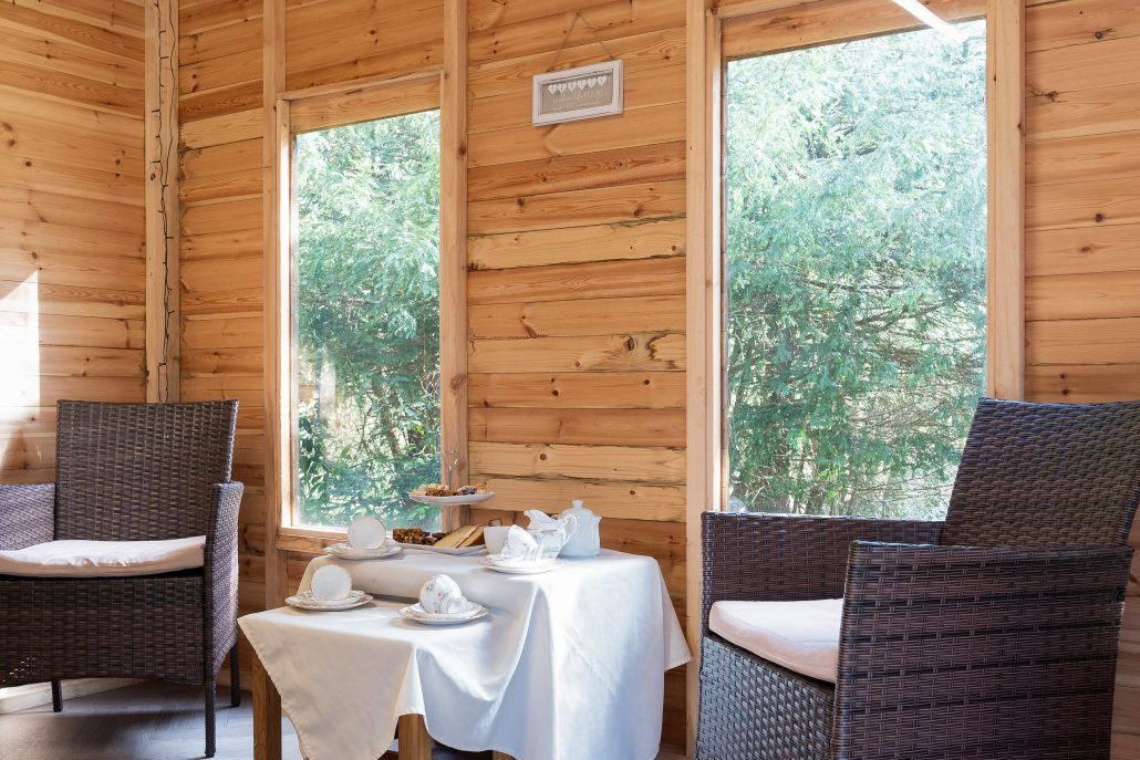 Summer House set up with tea and cake